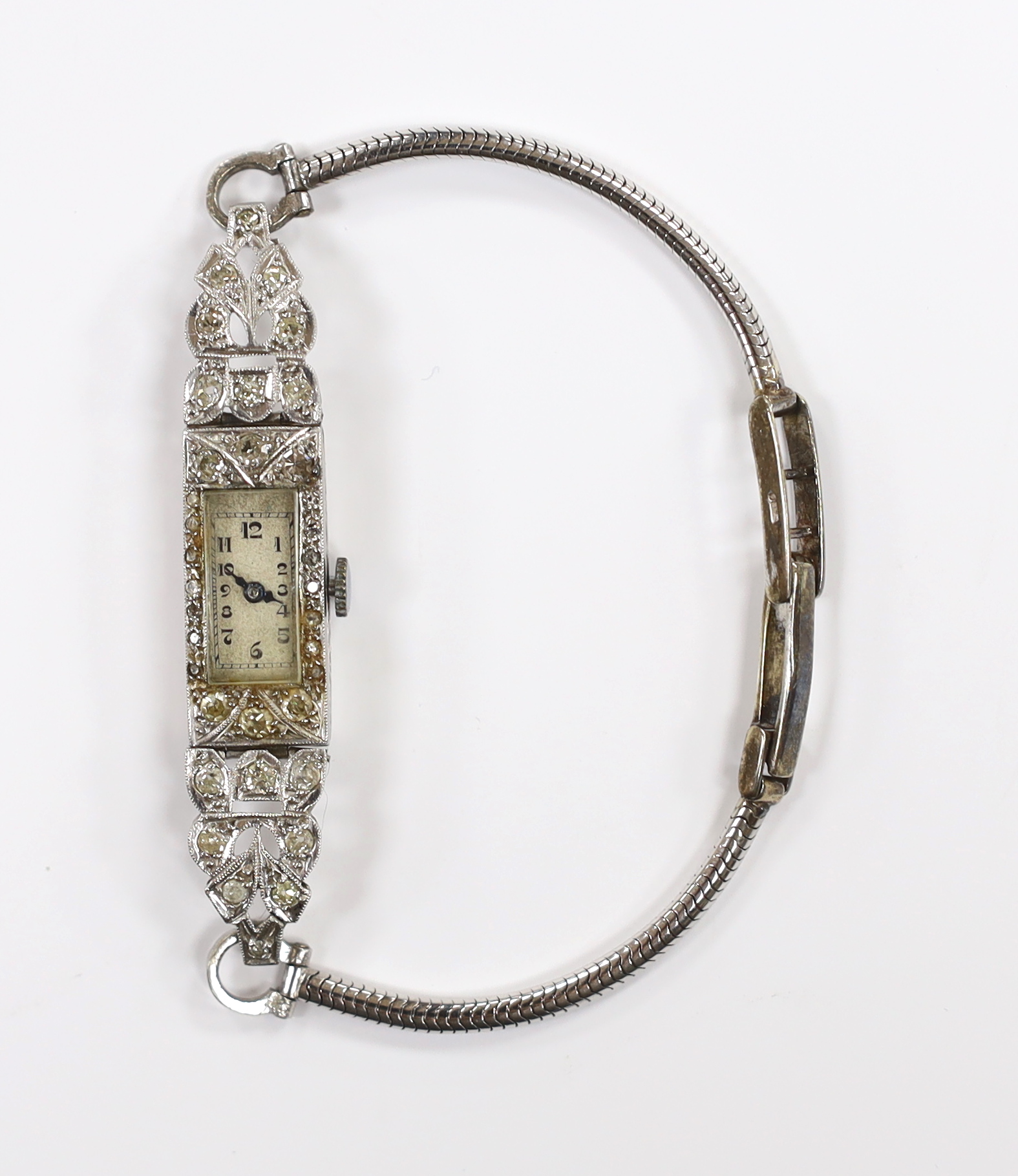 A lady's white metal stamped (All Platinum) and diamond cluster set manual wind cocktail watch, on a 9ct white gold bracelet, gross weight 14.3 grams.